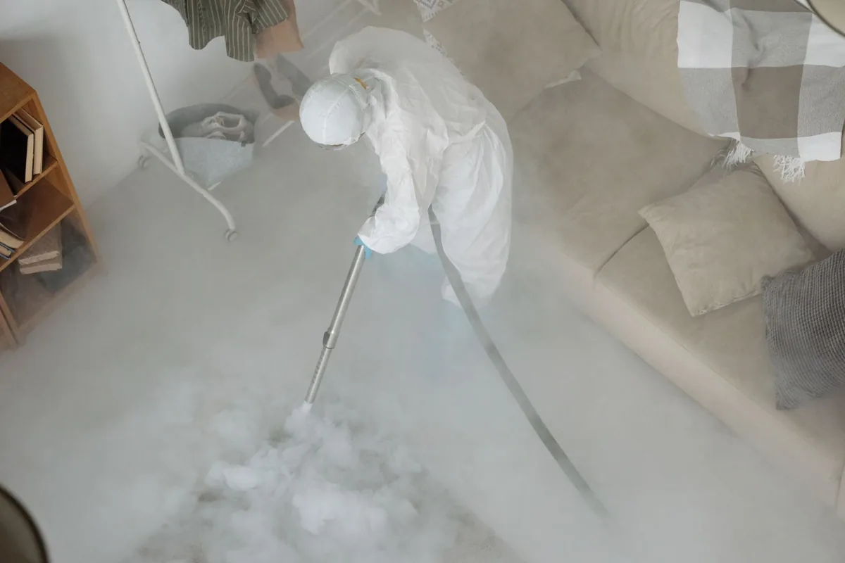 Biohazard cleanup technician in protective equipment, East Greenbush, NY